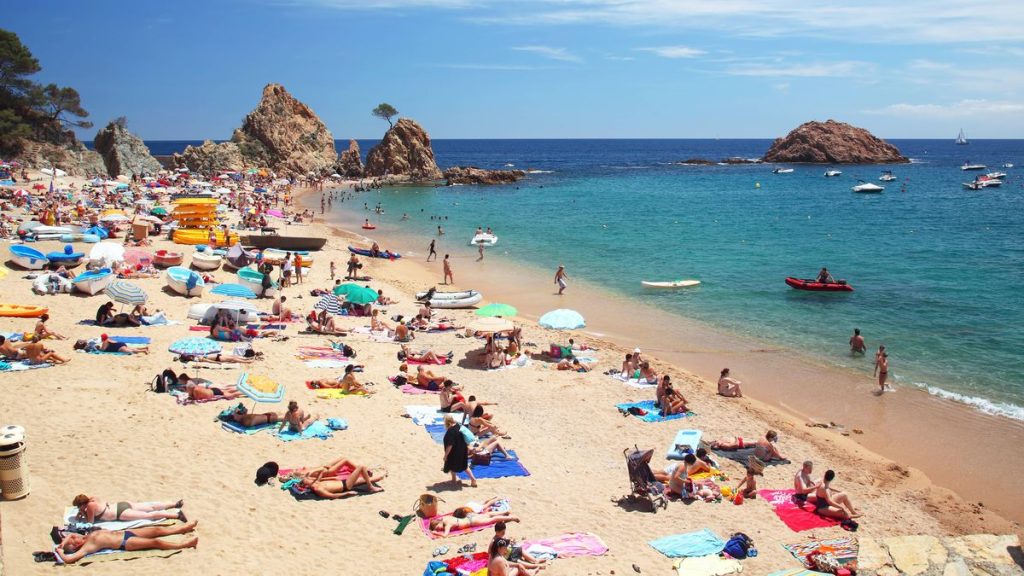 0 Crowded beach in Spain at Mediterranean Sea