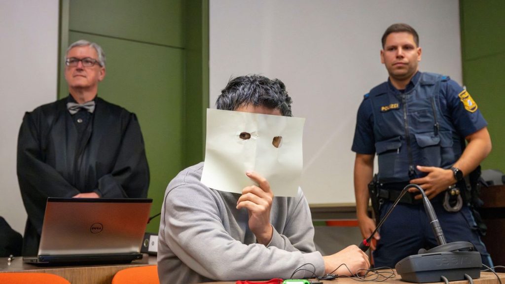 0 PAY Munich Germany 19th May 2025 The defendant sits in his seat in the courtroom of the Munich Regio