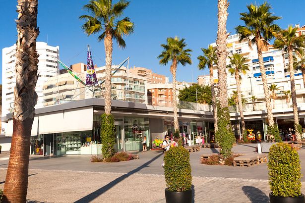 1 Palm trees cast shadows in new port development Muelle Uno in Malaga