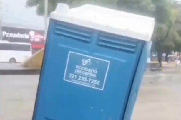 Unlucky bloke swept away 'mid poo' as flash flood sends portaloo down street 3 1 VIDEO Bloke swept away mid poo as flash flood sends Portaloo down road