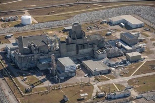 0 Aerial view of an industrial complex featuring multiple large buildings an extensive road network and surrounding open