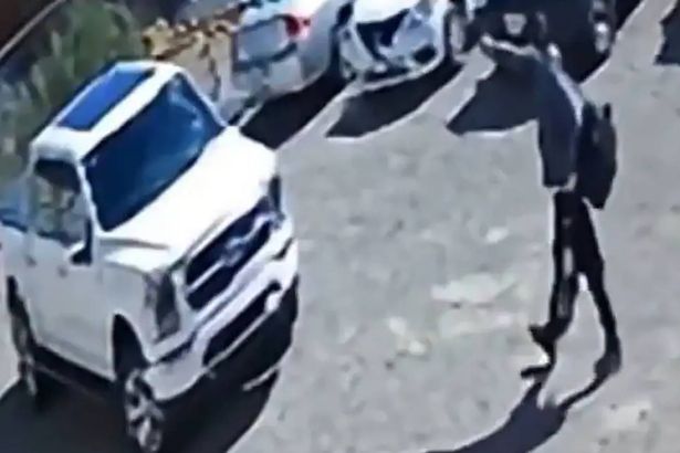 2 Ernesto Rascn approaching truck with gun drawn
